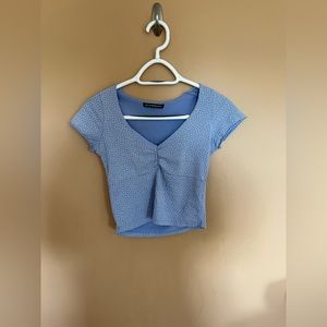 Either a size xs/small light blue Brandy Melville crop.